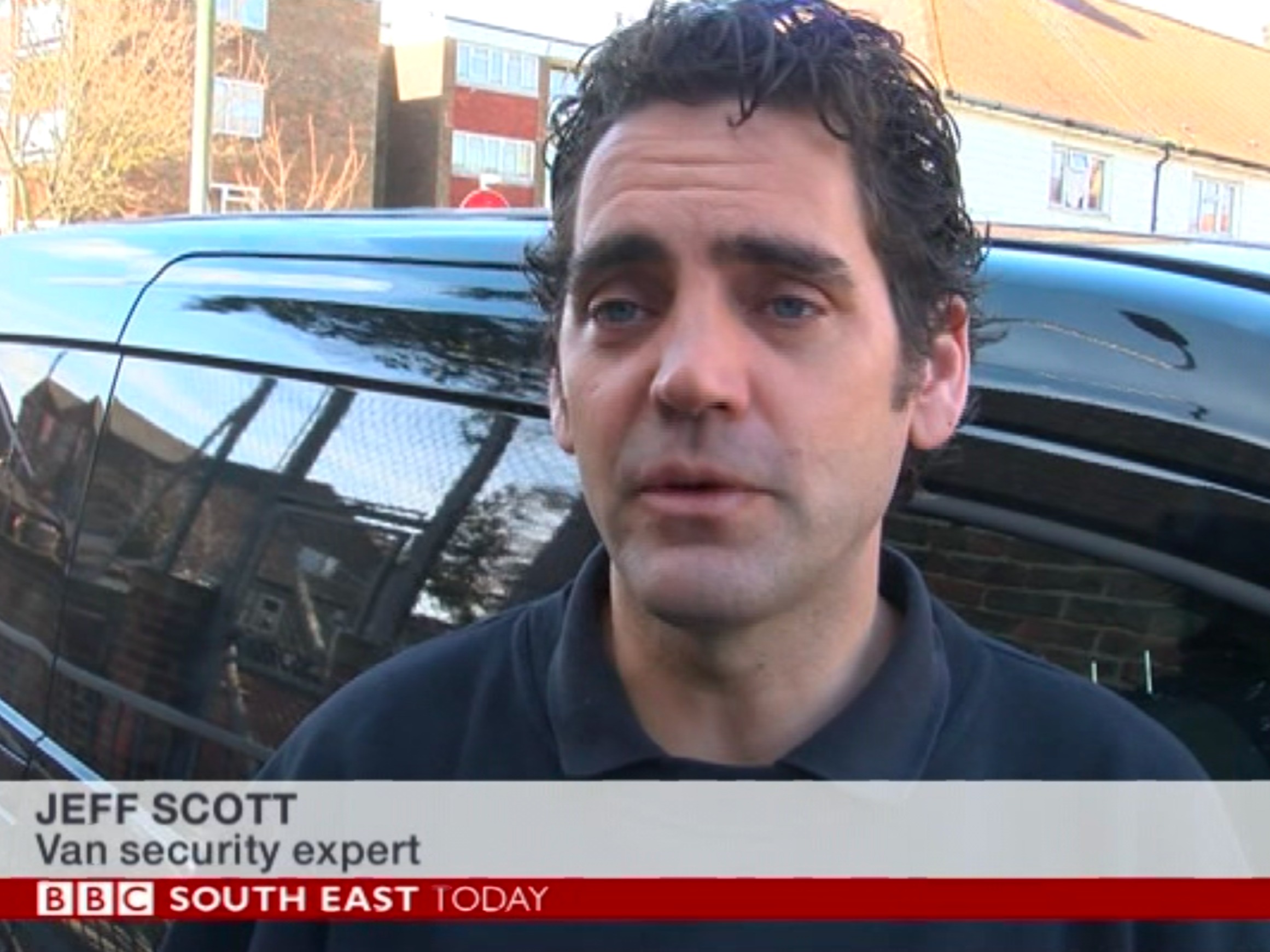 BBC news television frame showing Jeff Scott as 'Van security expert' with a van behind him